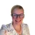 Bernadette Datka, Director at Spinnaker SCA, smiling in a professional headshot for GroupRB Marketing testimonial in Rock Hill, SC.