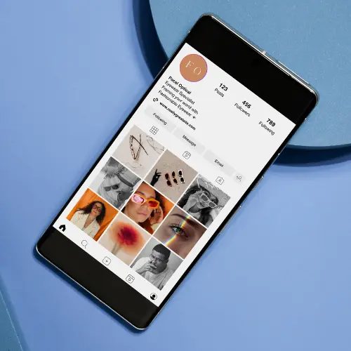Smartphone displaying an e-commerce product grid, representing mobile-friendly online store design for Rock Hill, SC businesses.